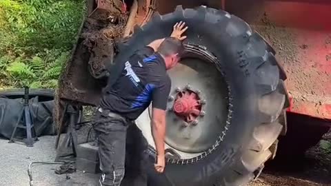 Vehicle repairman installs truck tires, vehicle repair engineering vehicle