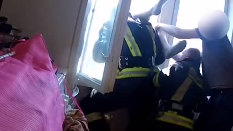 Firefighter catches suicide jumper in mid-air