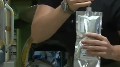 Astronaut drinking water at international space station