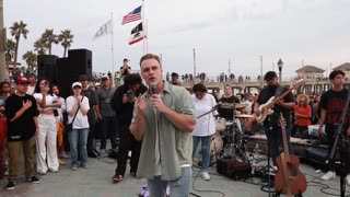 Open air preaching the gospel to thousands in Huntington Beach