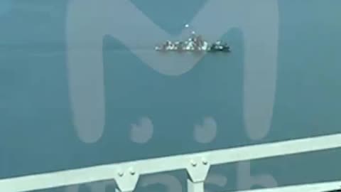 Military boats patrol the area near the Crimean bridge.