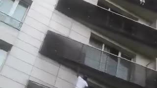 FRANCE — Young Man Scales Building In Seconds To Save Dangling Toddler!