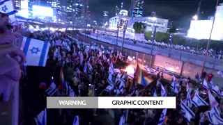 Cars drive through crowd of protesters in Tel Aviv