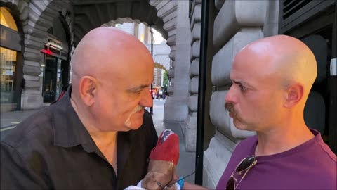 MAN TRYING TO SELL A WOMAN NEAR PICCADILLY CIRCUS