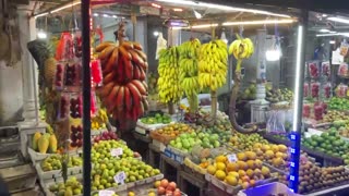 Buying pineapple at the fruit market in Nuwara Eliya, Sri Lanka