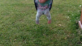 Baby girl swinging