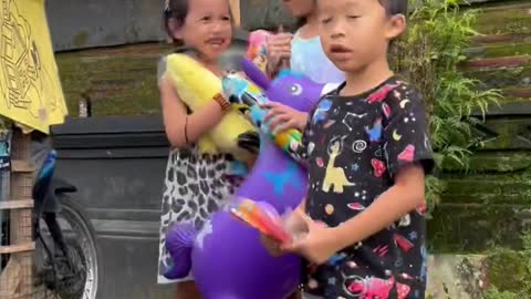 Balinese Santa Gives Gifts Away to Children