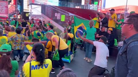 WATCH: Brazilian Election protesters say a prayer in Times Square