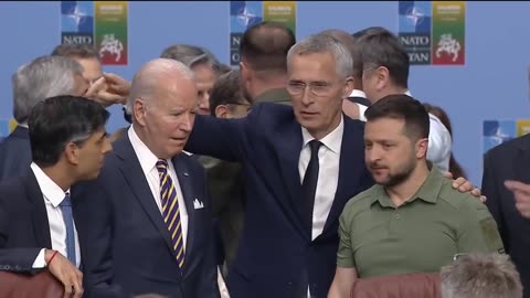 Biden gets in the way as world leaders reach over him to greet Zelenskiy