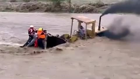 Rescue of people caught in flash flood by guy in bulldozer!!!!!