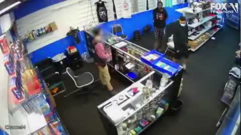 VIDEO: Gun battle breaks out between store employee and would-be robbers