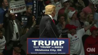 Trump stares down man in 'KKK' shirt