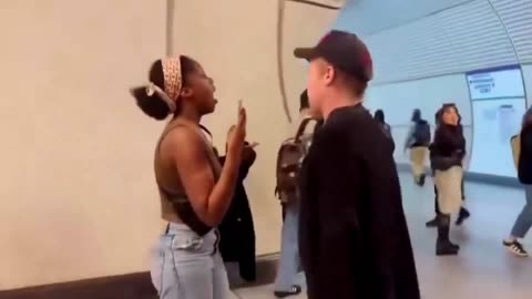 IDF Soldier racially profiles & assaults Black women in airport, shrinks when a man intervenes.