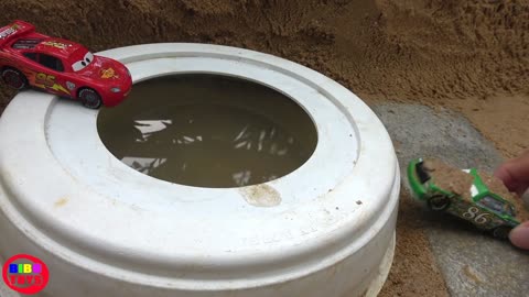 Red Cars and Green Cars Swim into Bucket with Mud and Water inside