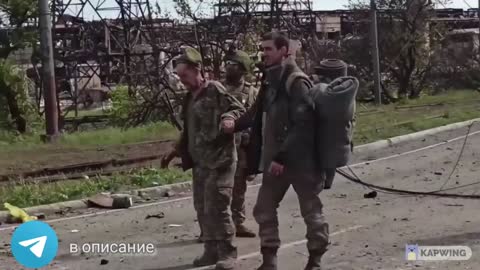 Completed defeated and demoralized Ukranian Pows march out of Azov steel factory