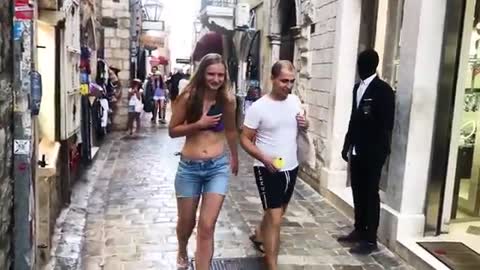 Fashion model scares people in public.