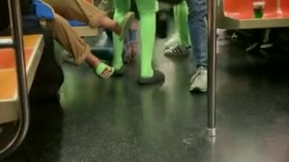 Women In Neon Green Body Suits ATTACK NYC Subway Passengers