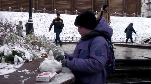 First snow in Kyiv amid power cuts, new attacks