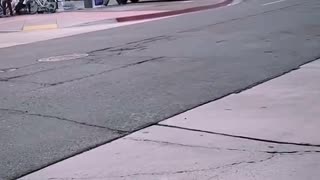 Meanwhile, in West Hollywood: Homeless guys blocking traffic a man in the car