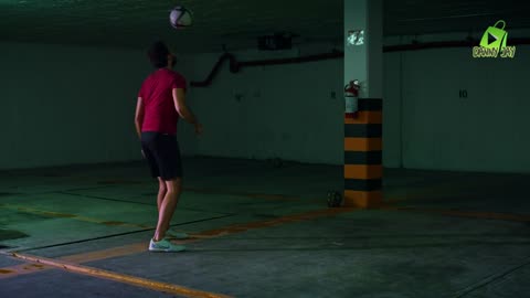 Talented freestyle soccer player juggling the ball