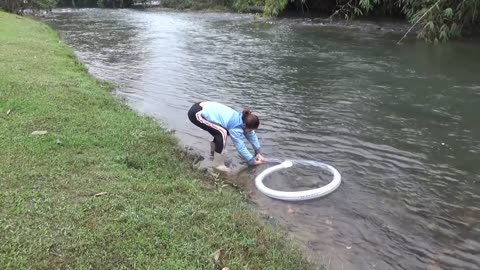 Hunting wild fish | Catch a lot of fish in the wild lake by using the big pump to suck the water-10