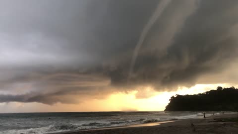 Water Spout Pulling Water from the Ocean Filmed from a Beach