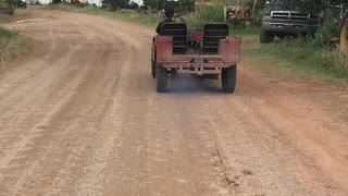 My Son driving Rusty Red