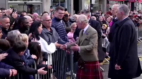 King Charles talks to refugee families in Scotland