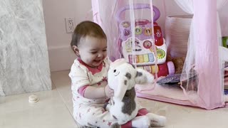 Baby Adorable Hugs Her Stuffed Animal