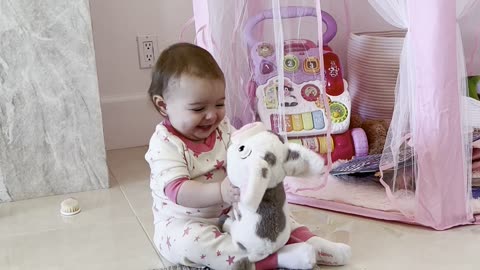 Baby Adorable Hugs Her Stuffed Animal