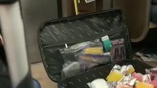 Man sells pepper spray, mixed drinks, and capri sun in a suitcase on subway train