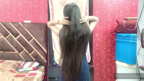 before sleeping a beautiful Rapunzel playing_ pampering_ smelling and making braid in her silkyhair