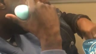 Man puts lotion on train