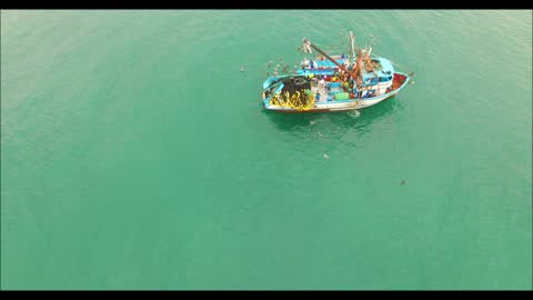 Shrimp Boat Offloading to a Smaller Boat, Crucita, Ecuador