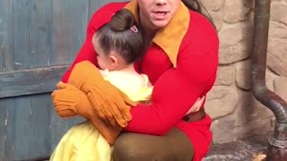Little Girl Hugs Gaston At A Disney Park And Won't Let Go