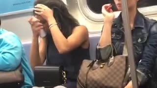 Woman sprays her hair on train
