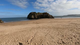Castle rock and beach. TENBY. WALES.