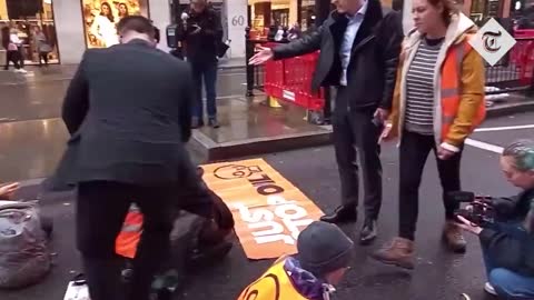 Just Stop Oil protestors spray paint Harrods orange and block roads