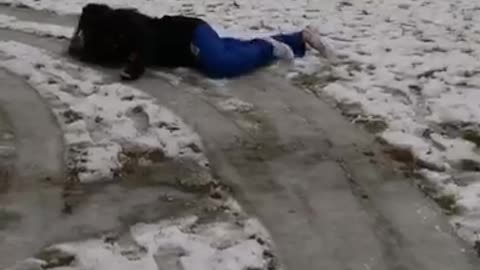 Girl blue joggers slips on icy floor