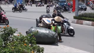 Vietnam, HCMC, Go Vap - Bicycle riding cardboard recycler - 2014-03