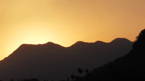 Sun over hills