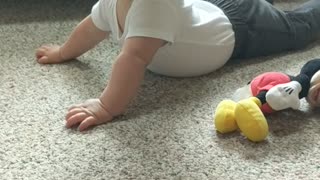 Funny Baby with a Temper Shakes Head at Mom