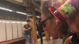 Blonde woman ear phones singing loud
