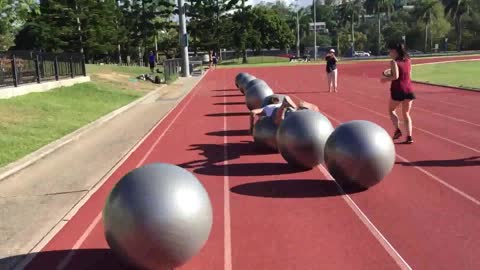 Guy Sets Record Surfing on Exercise Balls