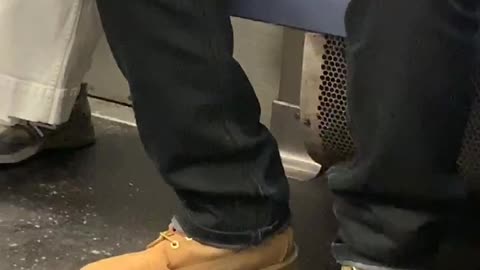 Man brown timbs boots clipping nails