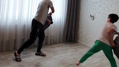 Blindfolded Pillow Fight Between Brothers