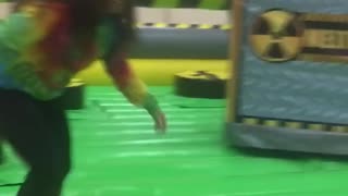 Girl tye dye shirt fails to jump over pole trampoline park