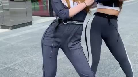 Two girls are dancing very cool