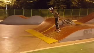 Roller skates woman tries to go up skate park ramp and hits back head