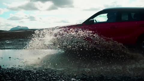 Car Driving Through Puddle In Slow Motion